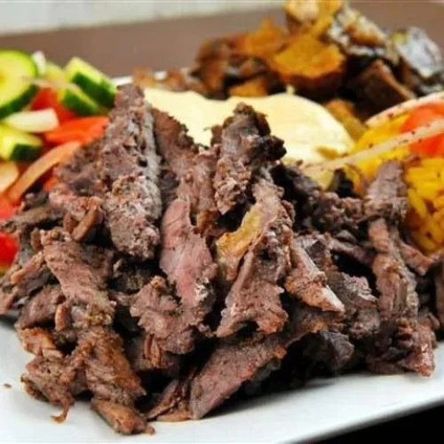 Beef Shawarma Platter - Slow-roasted beef shawarma served with rice and salad