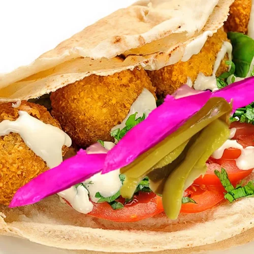 Falafel Wrap - Crispy falafel in warm pita with hummus, vegetables, and tahini