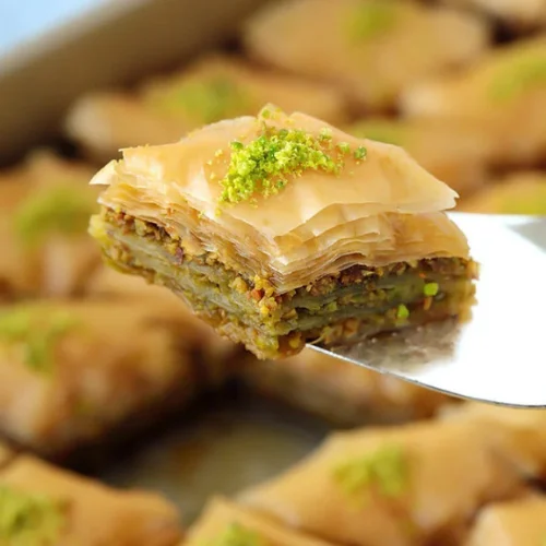Homemade Baklava - Layers of flaky phyllo pastry filled with chopped nuts and sweetened with honey syrup — our signature homemade dessert.
